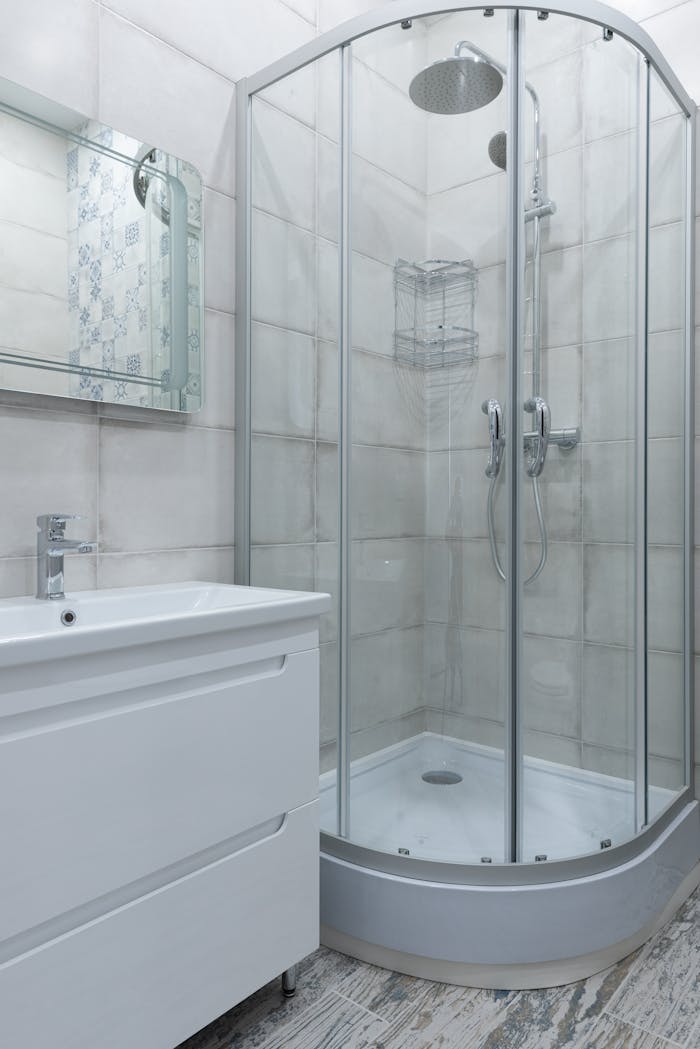 Contemporary bathroom featuring a glass shower and stylish fixtures.